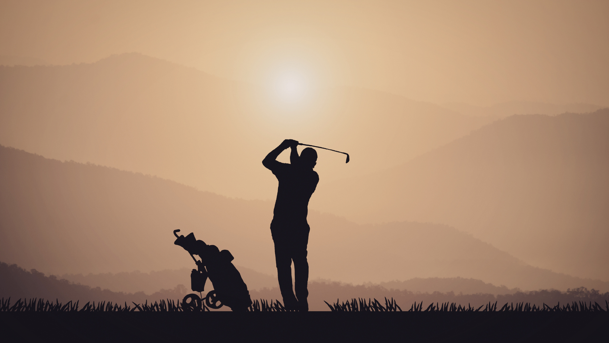 Silhouette of a golfer swinging a golf club